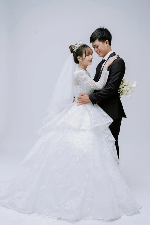 a couple is standing together wearing a wedding dress