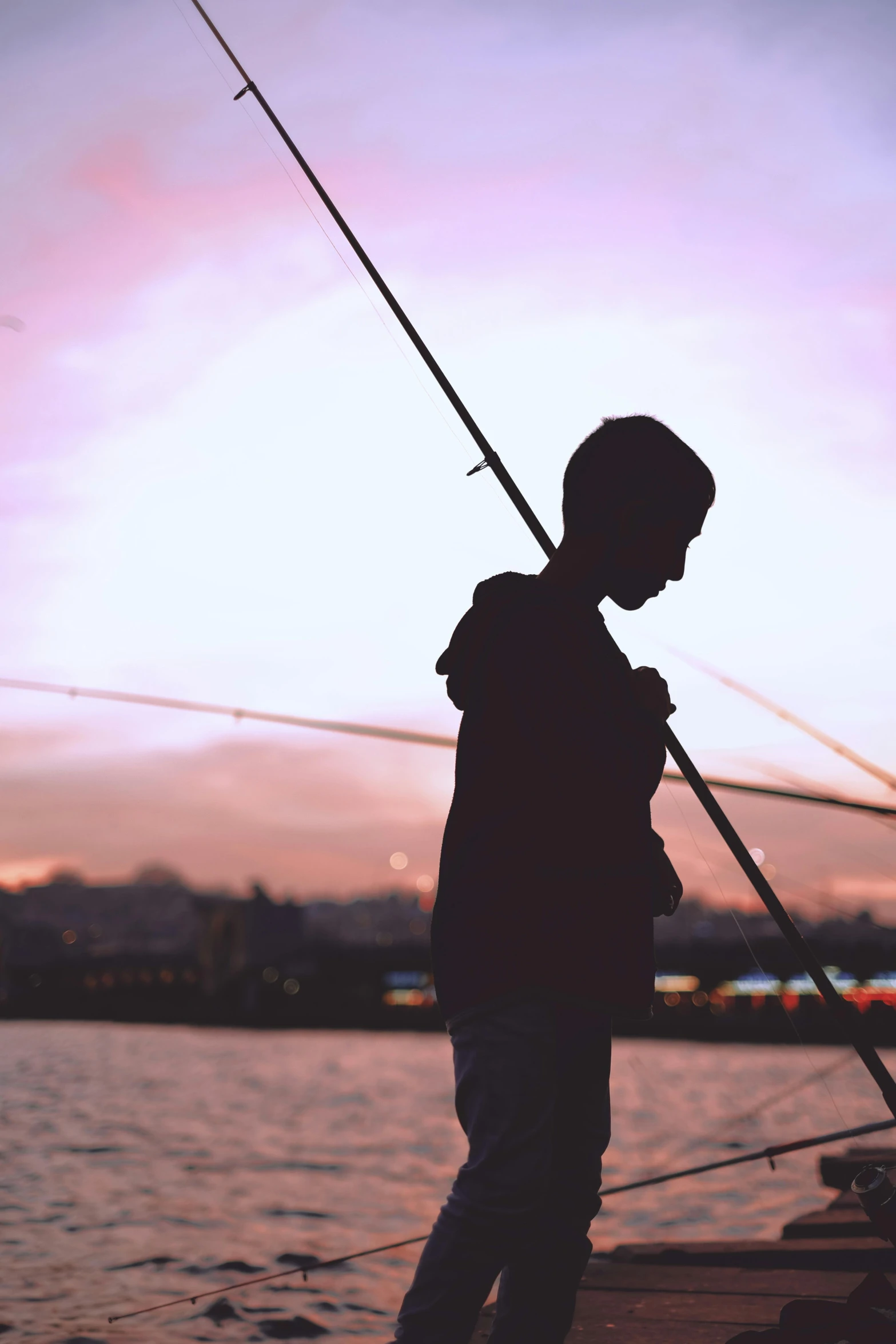 a person is holding on to a fishing pole