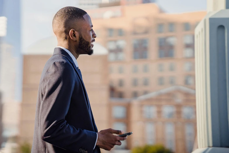 a man in a suit is talking on his phone