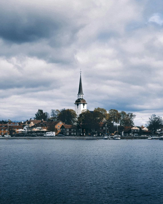 a large body of water with a cathedral in the background