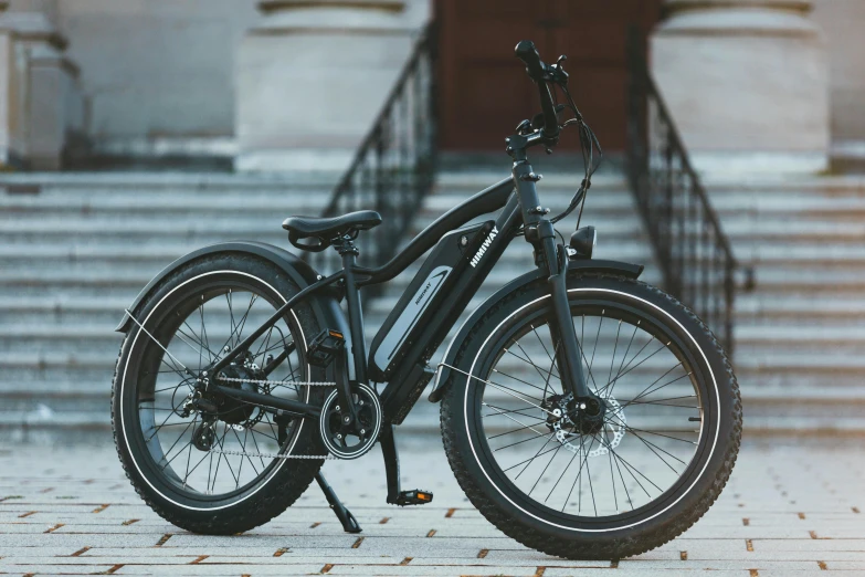 a bicycle parked in front of a stair case