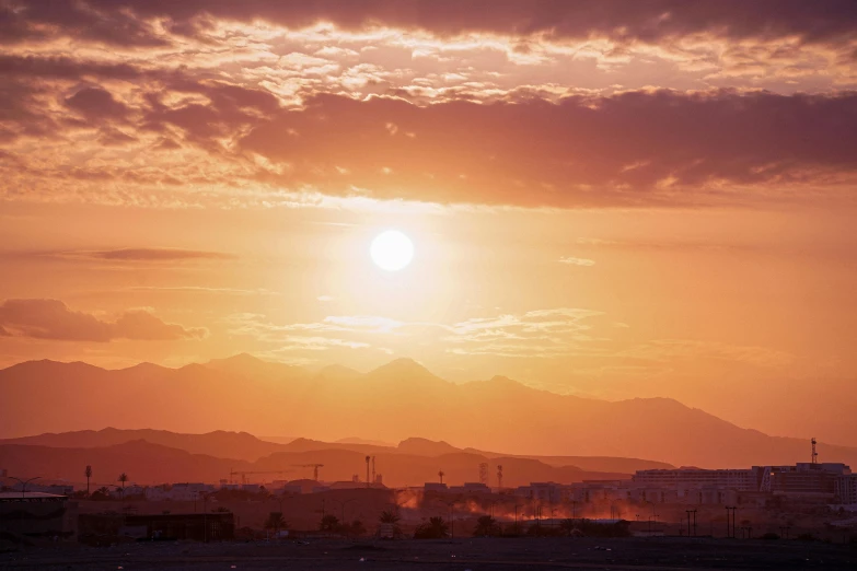 sunset in the city with hazy skies