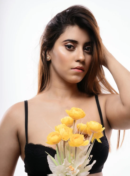 a close up of a woman holding flowers