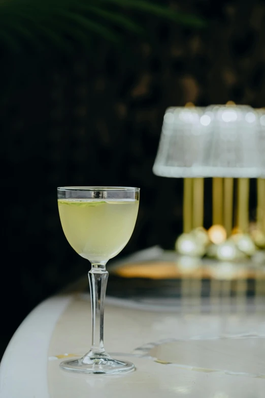 glass filled with white liquid on top of table