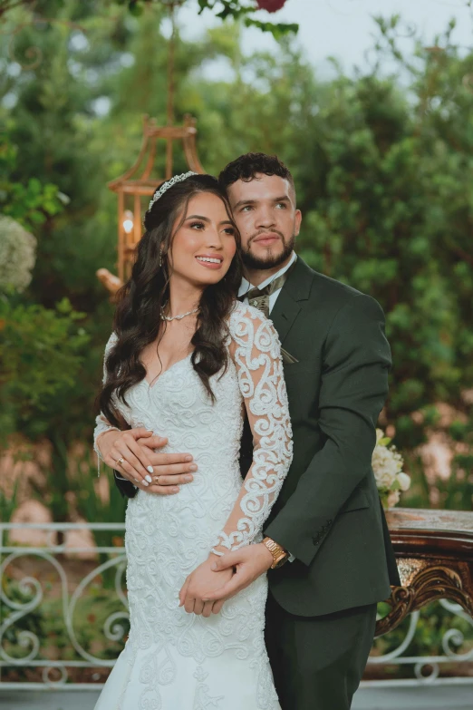 a bride and groom posing for the camera