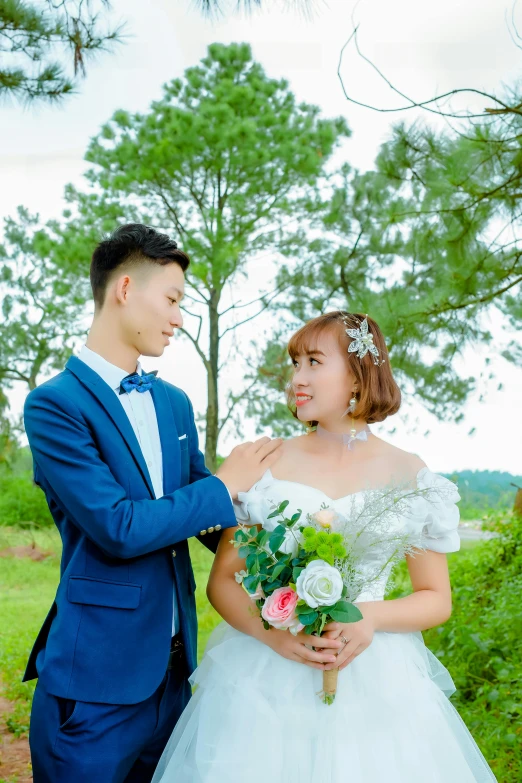 man in blue suit and woman in a wedding dress