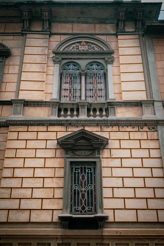 an old building with some windows and a clock above it