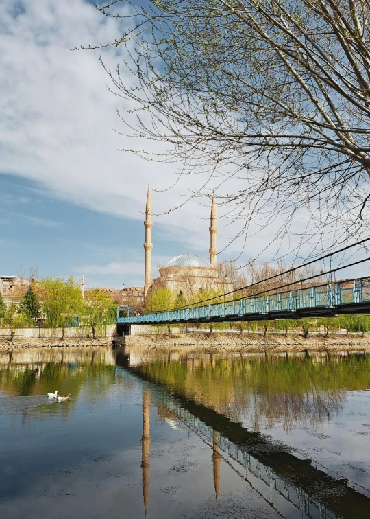 a bridge is running across a small body of water