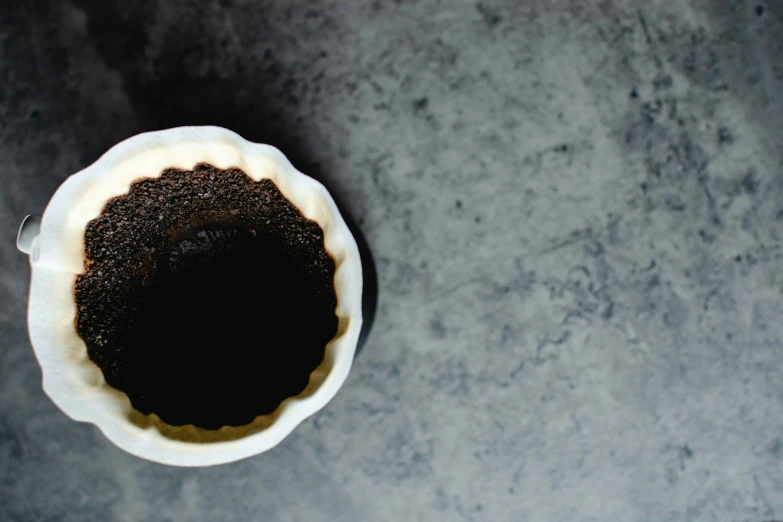 there is a chocolate cake in a white bowl