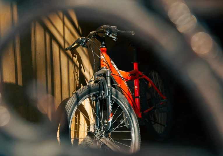 a bike that is leaning against the wall