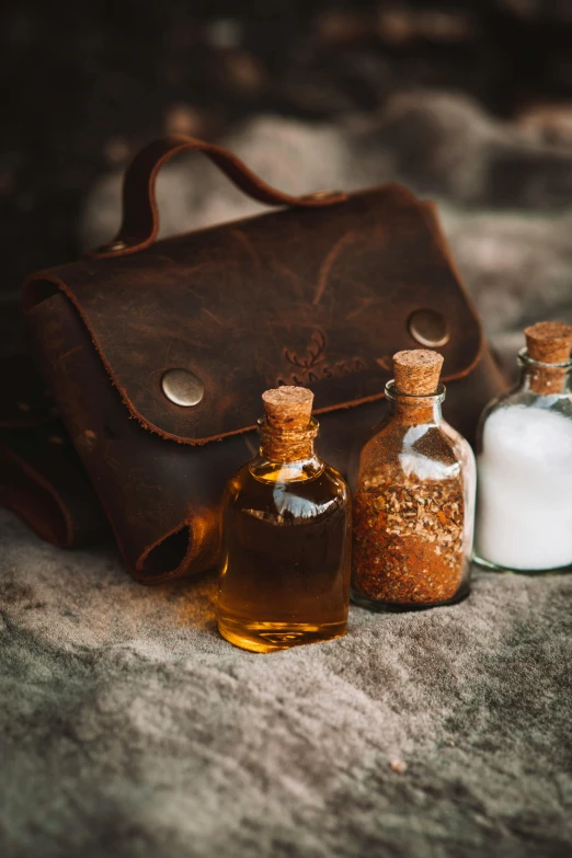 three different types of bottles and an old bag