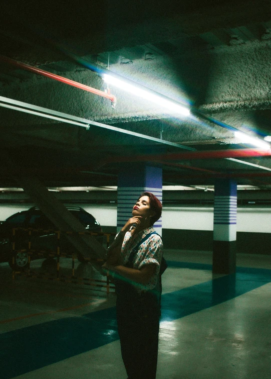 a person standing on the ground near some lights