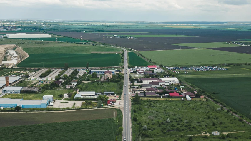 an aerial view of a small village and other small towns