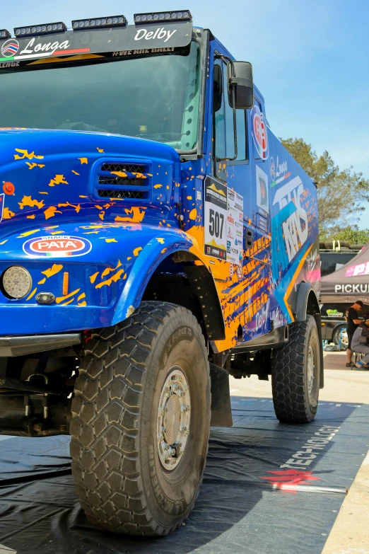 an all terrain utility truck with a large tire