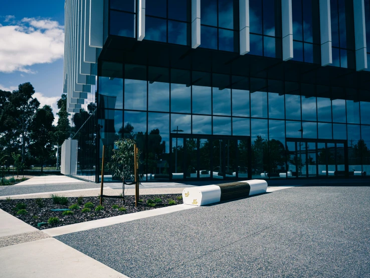 a building has a lot of windows and trees outside