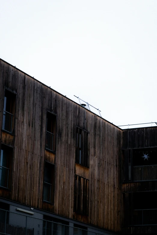 old wood building with two balconies at the front of it