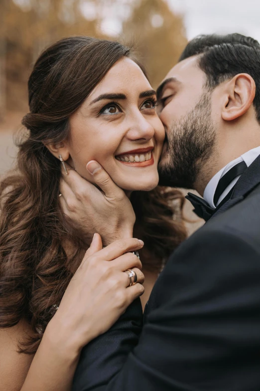 a man and woman sharing a kiss