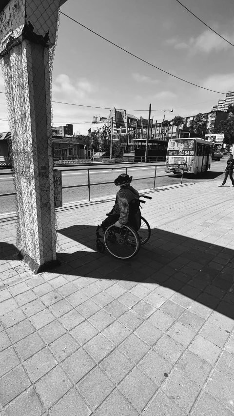 a person riding a bike on a brick walkway