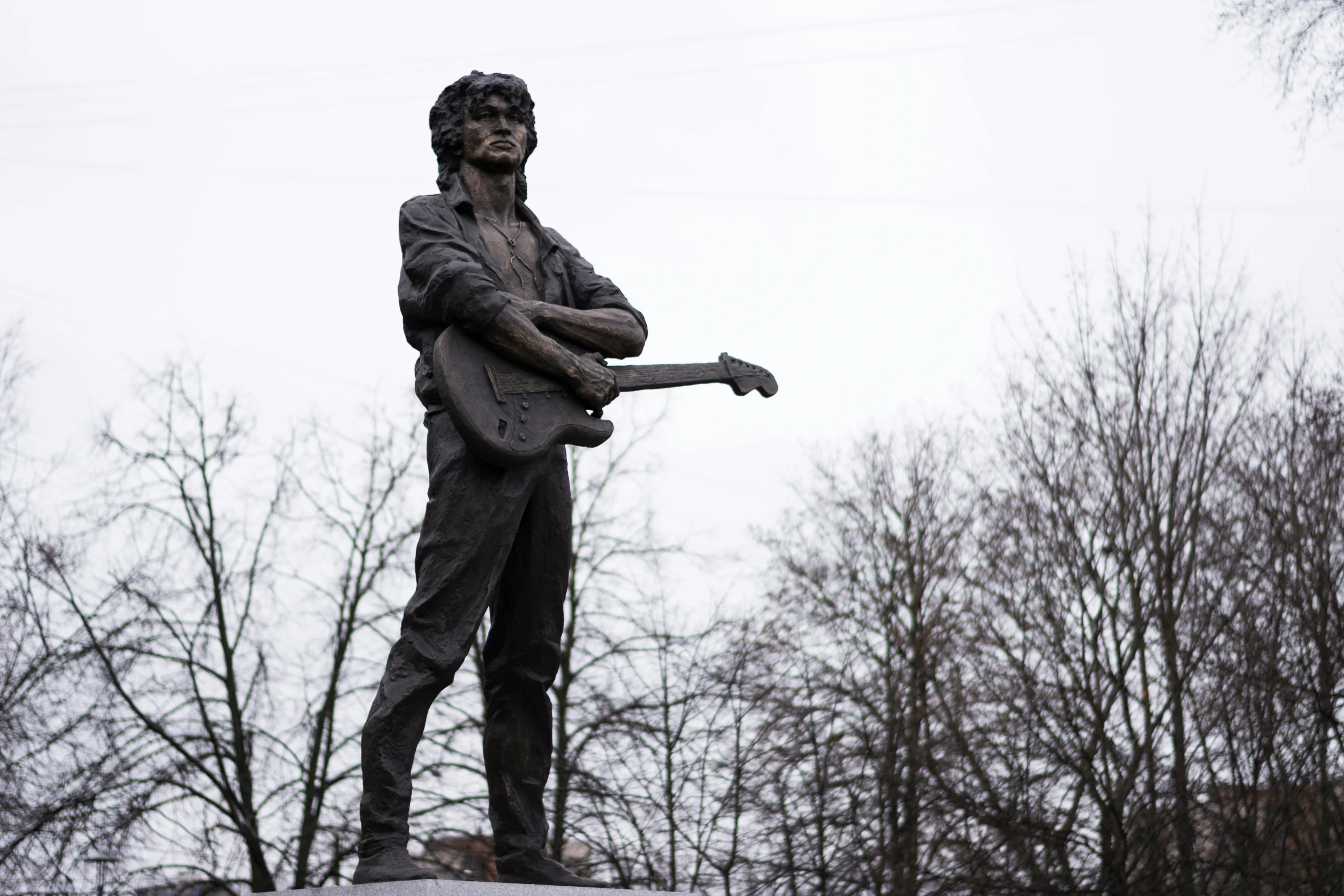 a statue of a man holding a baseball bat