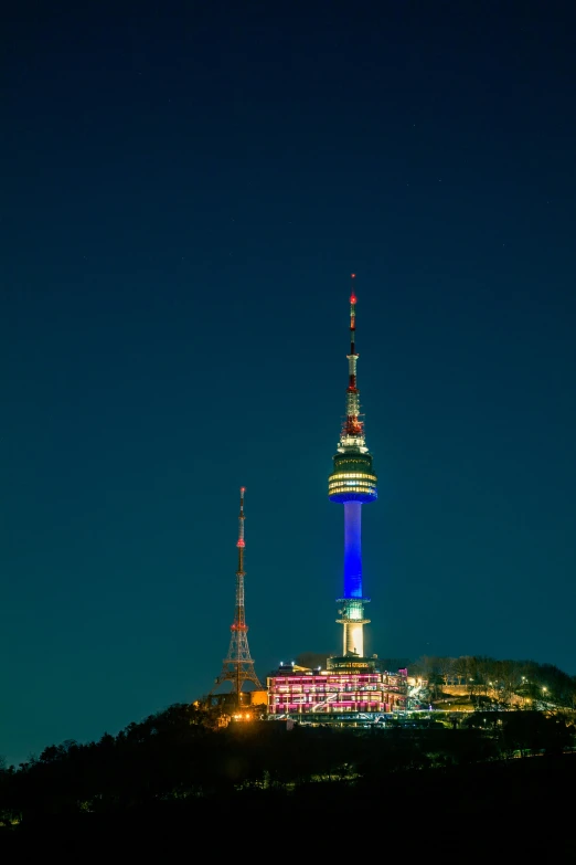 a very tall building with some lights on