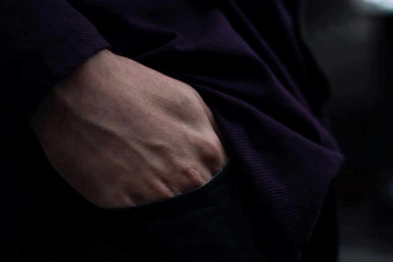 a mans arm with no nails and an intense look on it