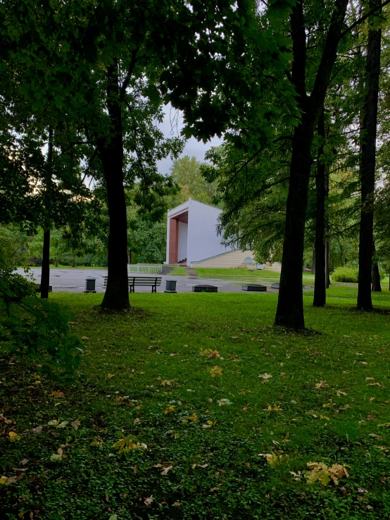 the park is littered with picnic tables and benches