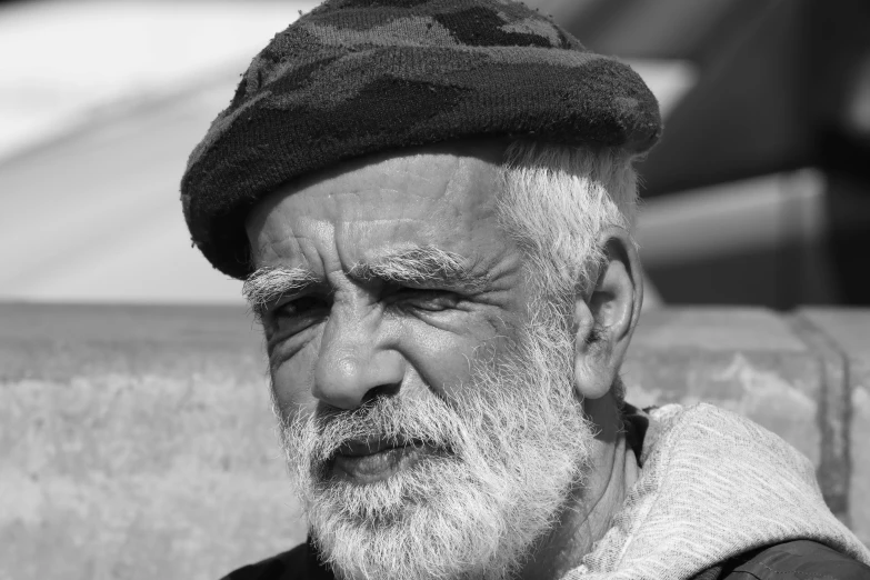 an older man with a hat and beard