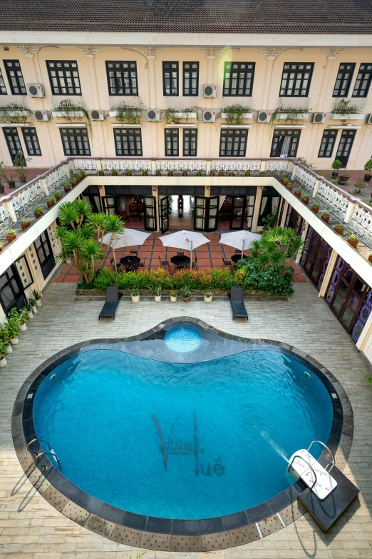 a large swimming pool surrounded by buildings