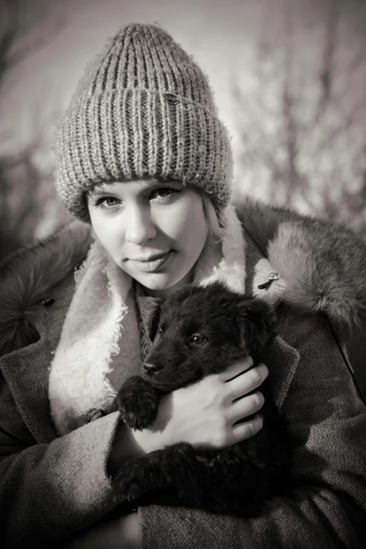 black and white pograph of woman holding teddy bear