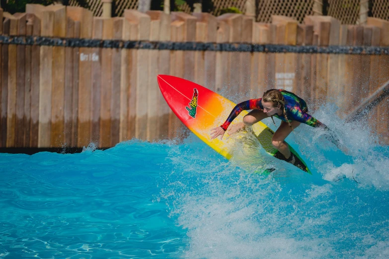 a surfer is holding onto his board while riding the waves