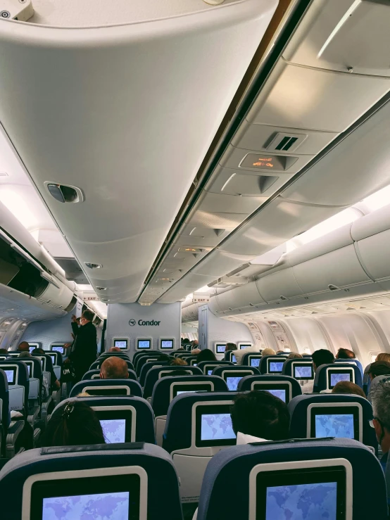 there are two computer monitors on the seats of this airplane