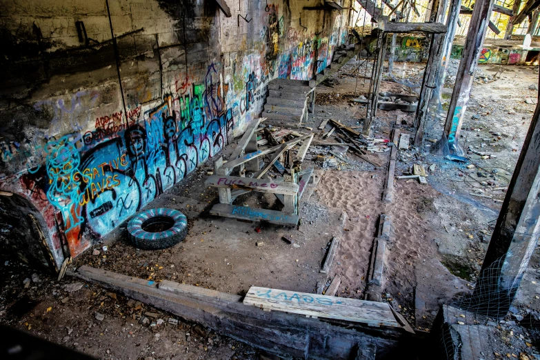 an old abandoned building is covered in graffiti