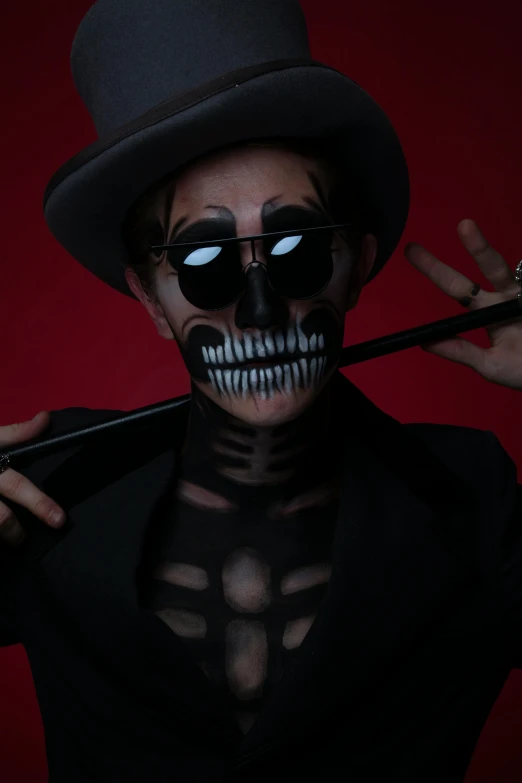 an image of a skeleton wearing a hat and holding scissors