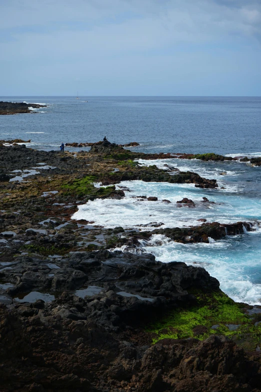 a view from the cliff looking out at the ocean