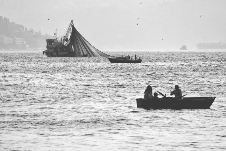 people are on a boat out in the water