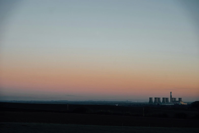 an image of a factory and factory during the sunset