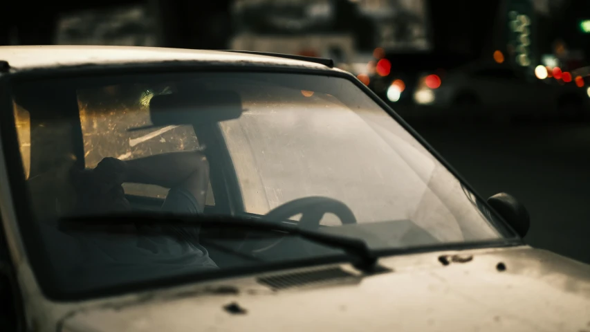 a close up of the dashboard and front view window of a car