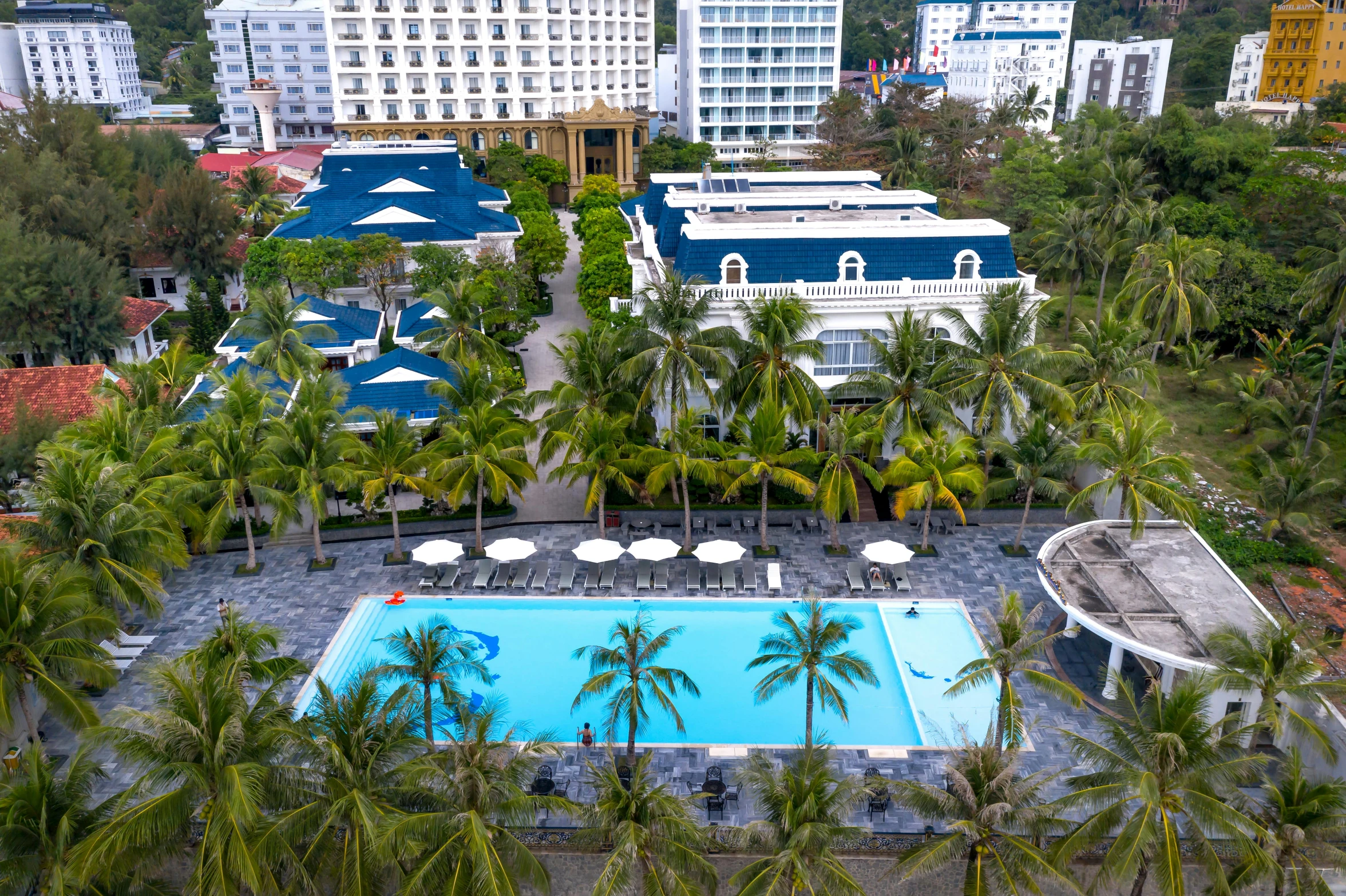 a swimming pool next to an overcast city