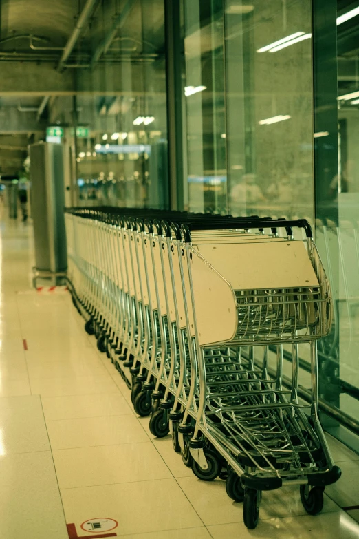 a few carts are parked at the side of the building