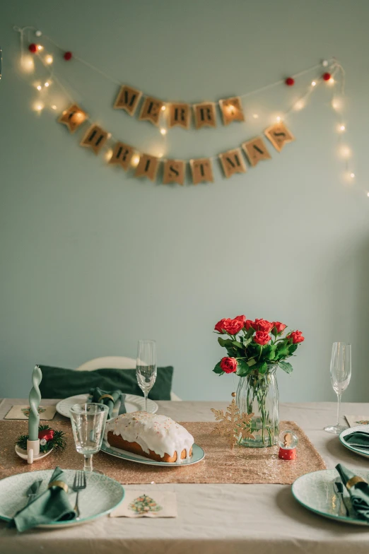 table set for a celetion with flowers and plates