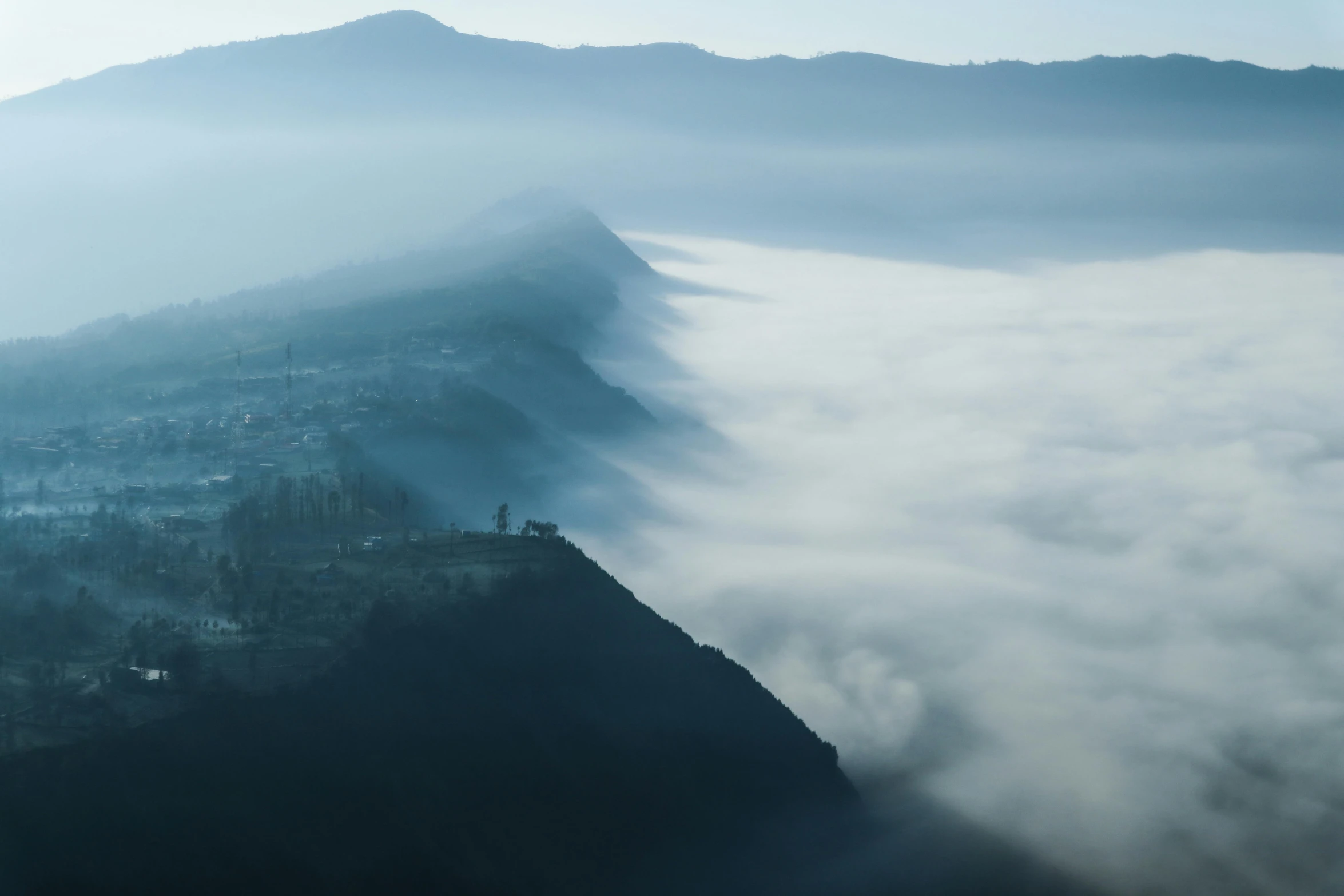 an aerial po shows the high rise of a mountain