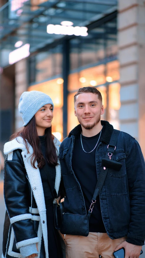 a man and a woman are posing together