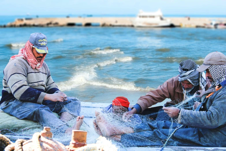 three people who are on a small boat