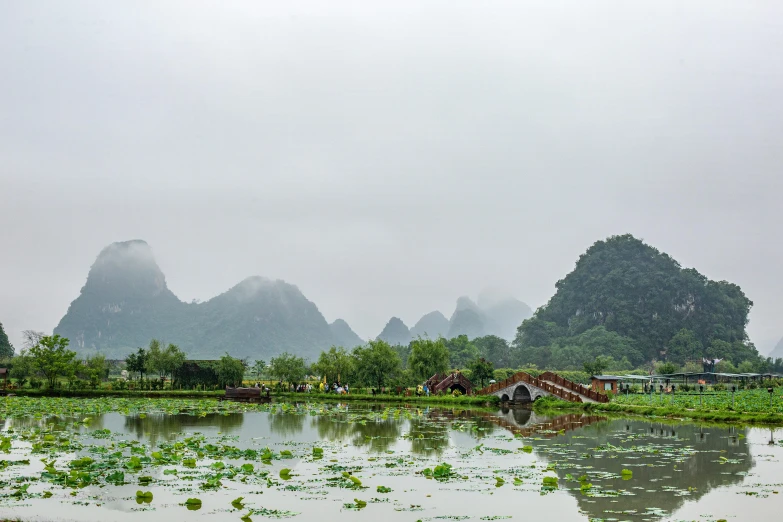 a large lake sitting between two mountains in the distance