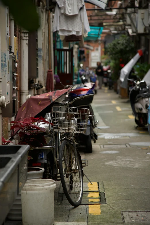 the bike is parked on the side of the street