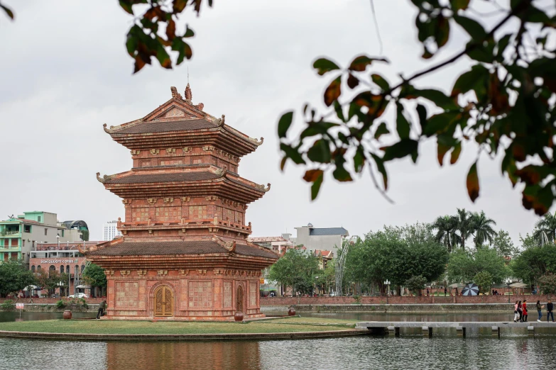 a tower by some water in a park