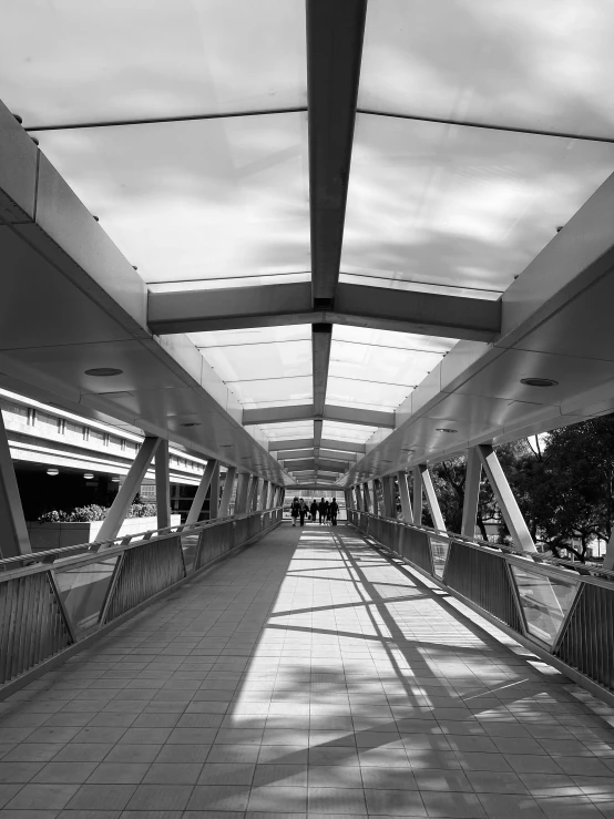 black and white po of walkway with many people