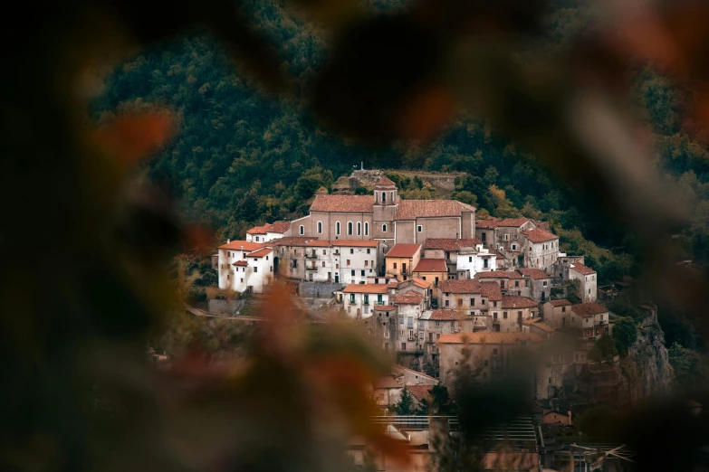 some houses sitting on top of a hillside