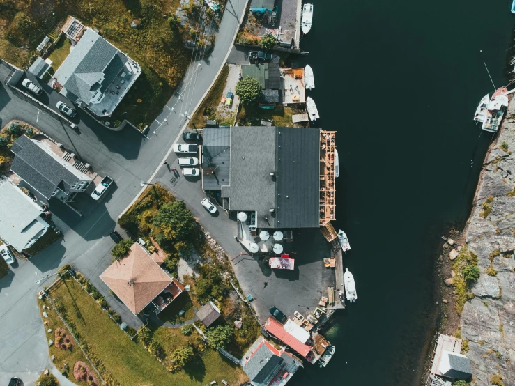 a city street by a lake near a small town