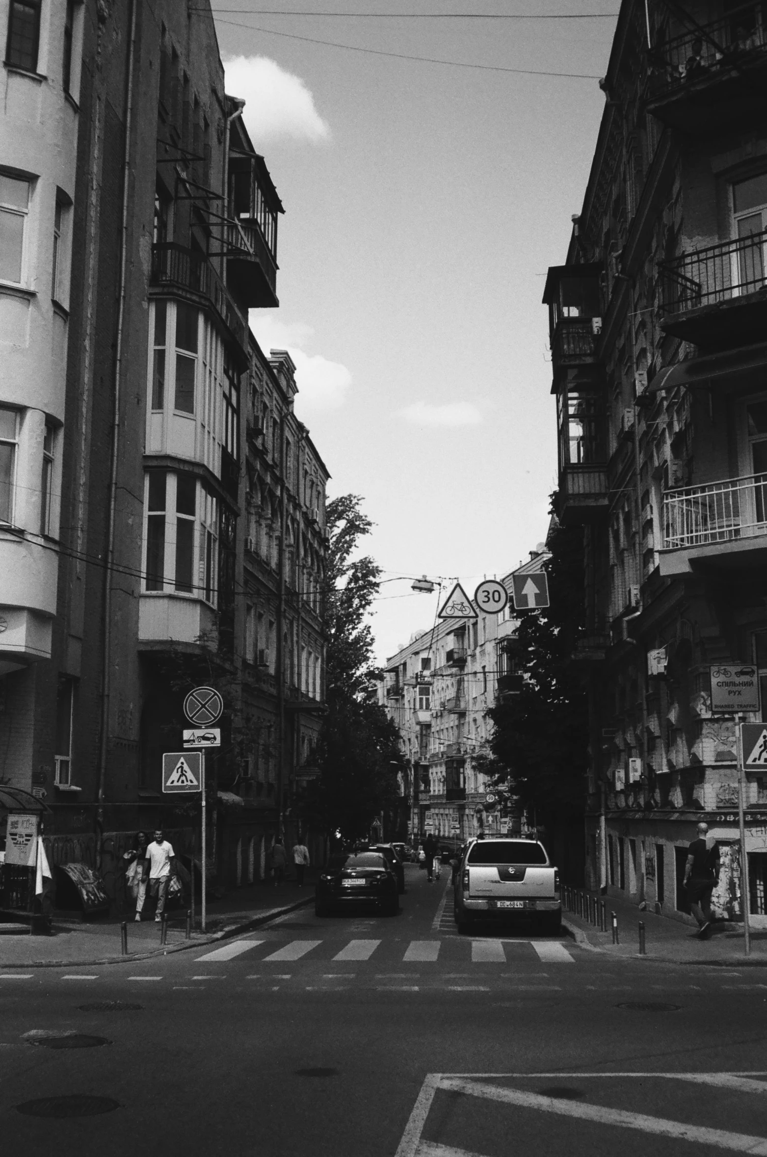 a picture of cars and buildings from the street